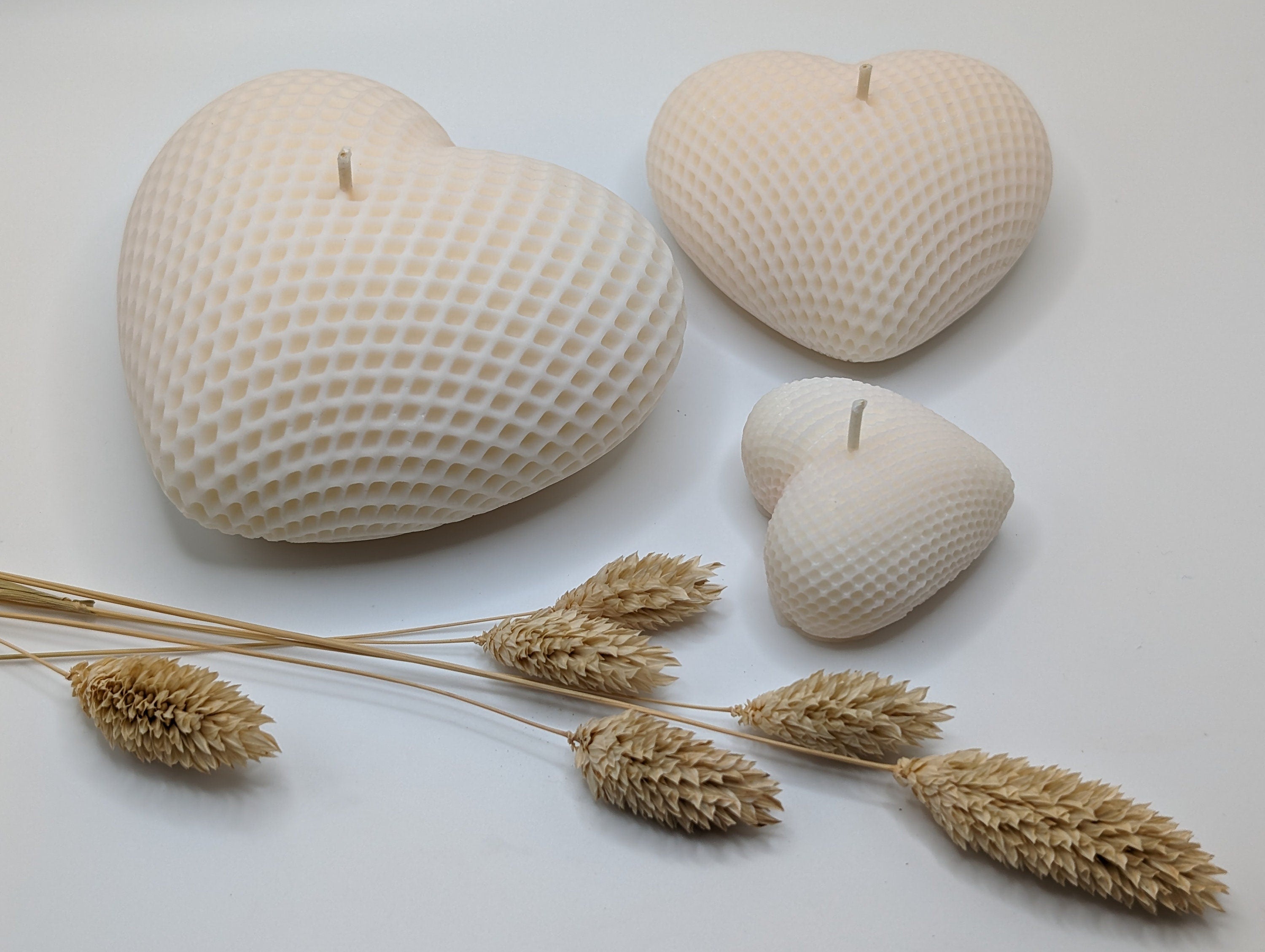 Heart-shaped white candles with textured surfaces on a light background, handmade soy home decor Set of 3 white candles different size small medium large